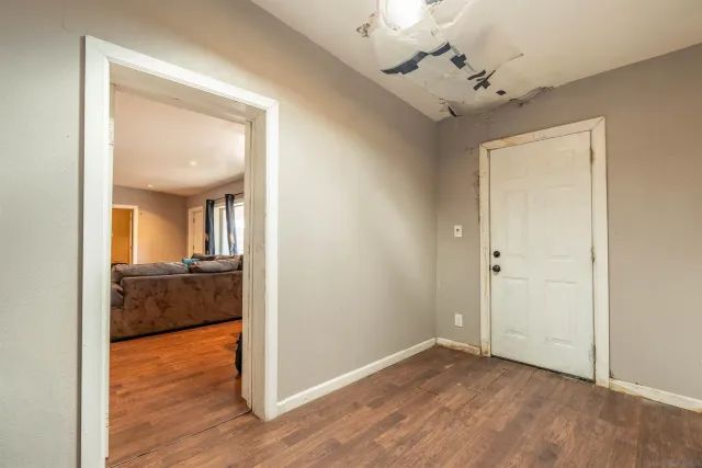 a view of a room that has a bed in it