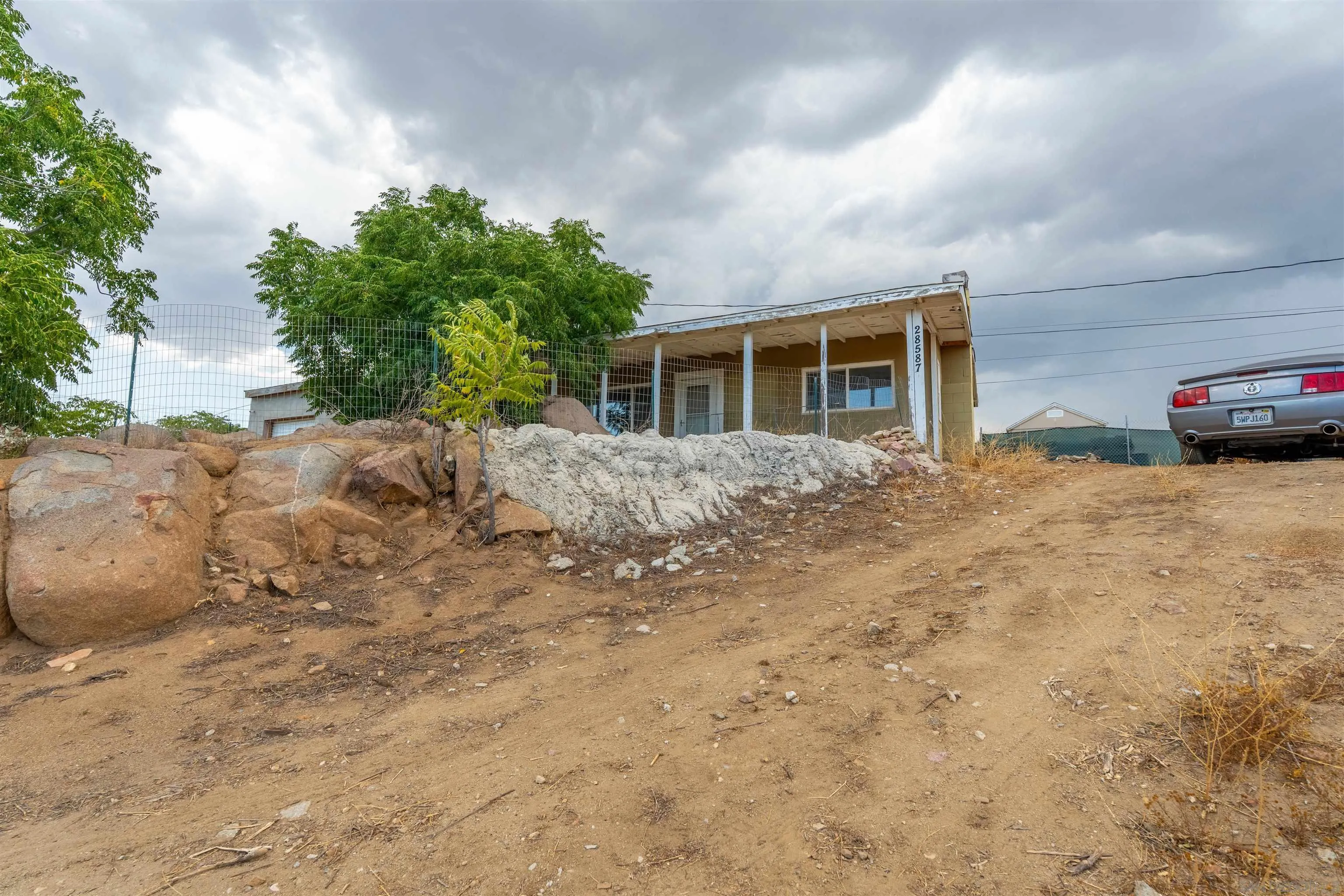 28587 Goetz Road Canyon Lake, CA 92587 - Photo 21 of 24 a view of a house with a yard