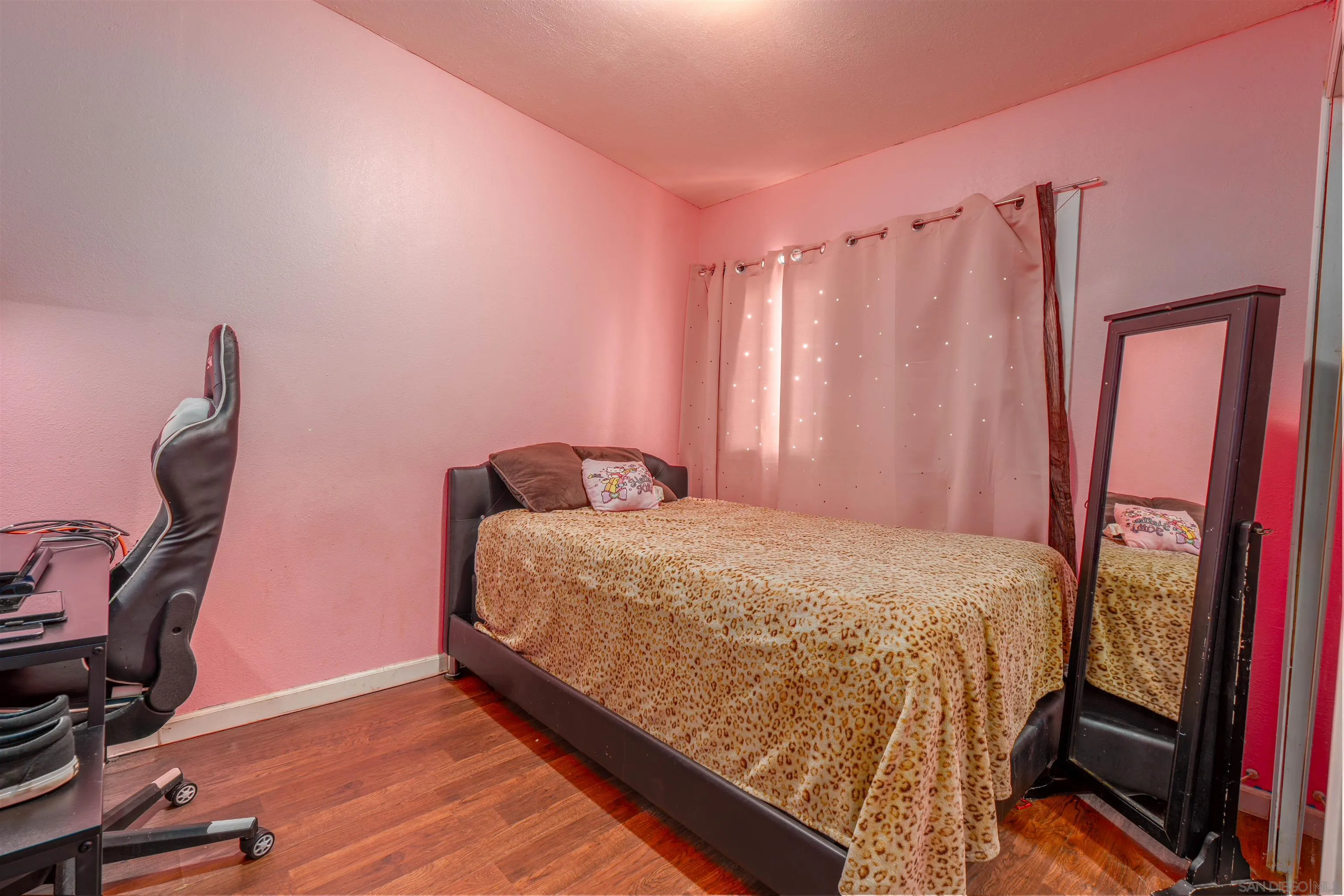 28587 Goetz Road Canyon Lake, CA 92587 - Photo 7 of 24 a bedroom with a bed and a mirror