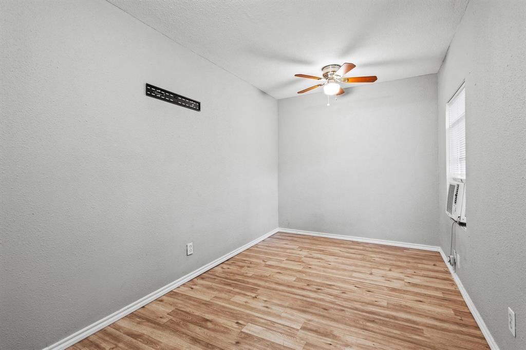 701 West Hull Street, Unit 1012 Denison, TX 75020 - Photo 16 of 22 a view of a room with wooden floor
