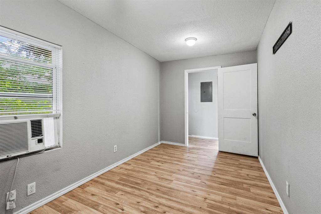 701 West Hull Street, Unit 1012 Denison, TX 75020 - Photo 18 of 22 a view of a room with wooden floor and a window