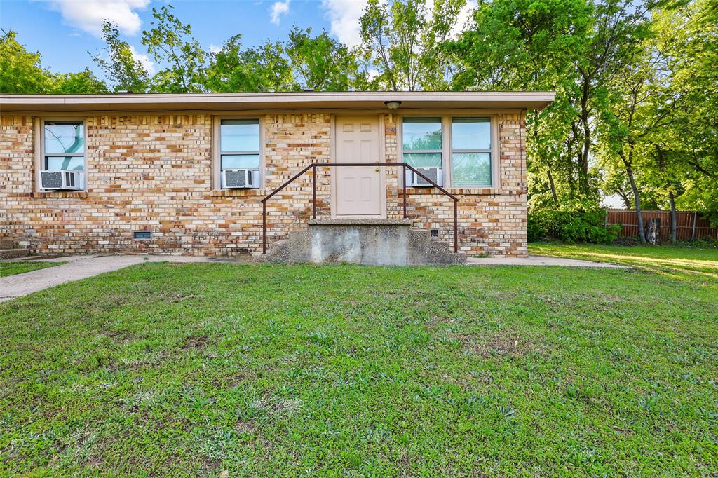 701 West Hull Street, Unit 1012 Denison, TX 75020 - Photo 3 of 22 a view of a backyard with plants and large tree