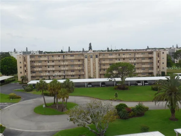 a view of a swimming pool and a yard