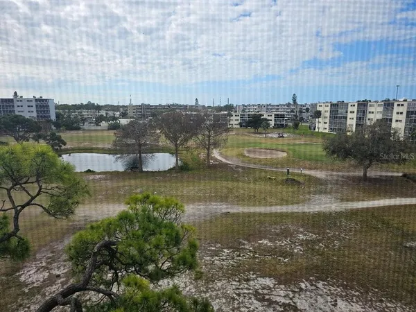 an aerial view of a city with lawn chairs