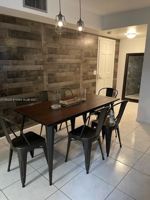 225 South Beach Road, Unit 105 Tequesta, FL 33469 - Photo 8 of 16 a view of a dining room with furniture