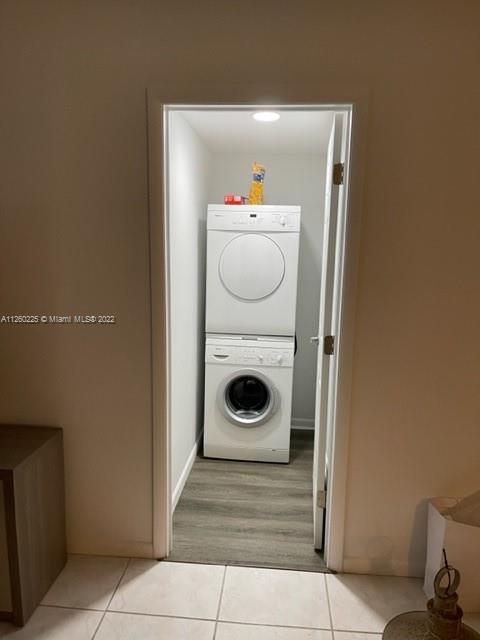 225 South Beach Road, Unit 105 Tequesta, FL 33469 - Photo 9 of 16 a bathroom with a toilet and washing machine