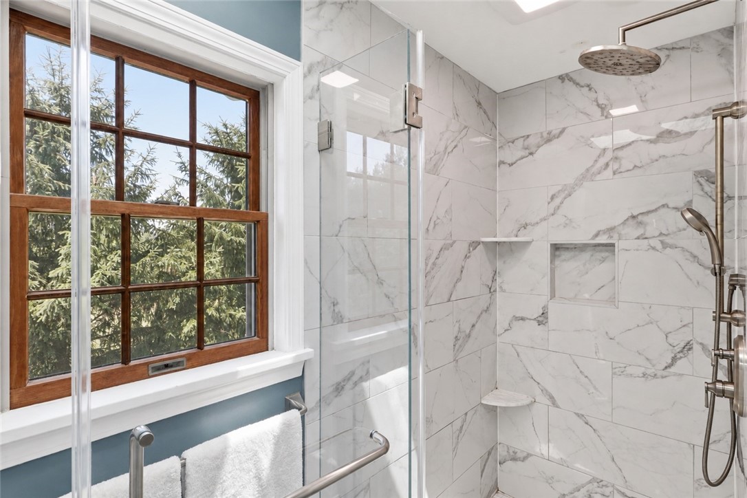 2057 Stirnie Road Victor, NY 14564 - Photo 29 of 48 A closer look inside the second-floor private primary bathroom, highlighting the sleek walk-in shower.