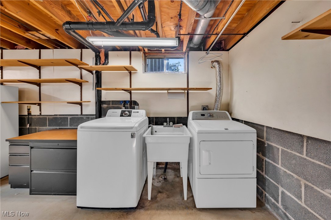 3145 Gale Road Willoughby, OH 44094 - Photo 16 of 31 Washer and dryer with shelving and folding area.