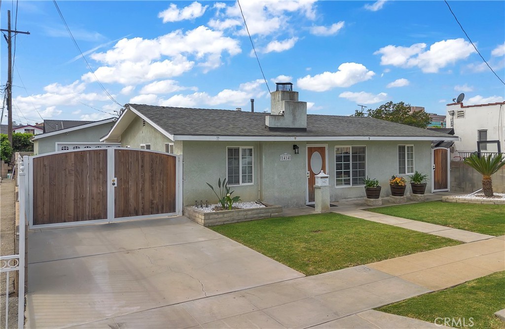 1414 West Shorb Street Alhambra, CA 91803 - Photo 1 of 33 a front view of a house with a garden and yard