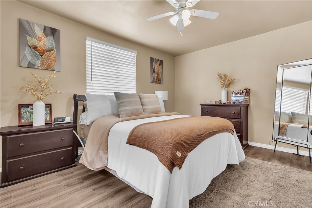 1414 West Shorb Street Alhambra, CA 91803 - Photo 15 of 33 a spacious bedroom with a bed and a chandelier