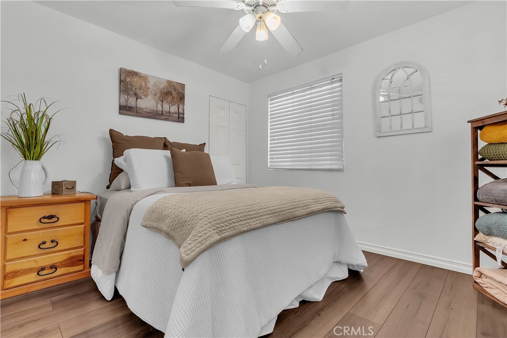 1414 West Shorb Street Alhambra, CA 91803 - Photo 17 of 33 a bedroom with a bed and a chandelier