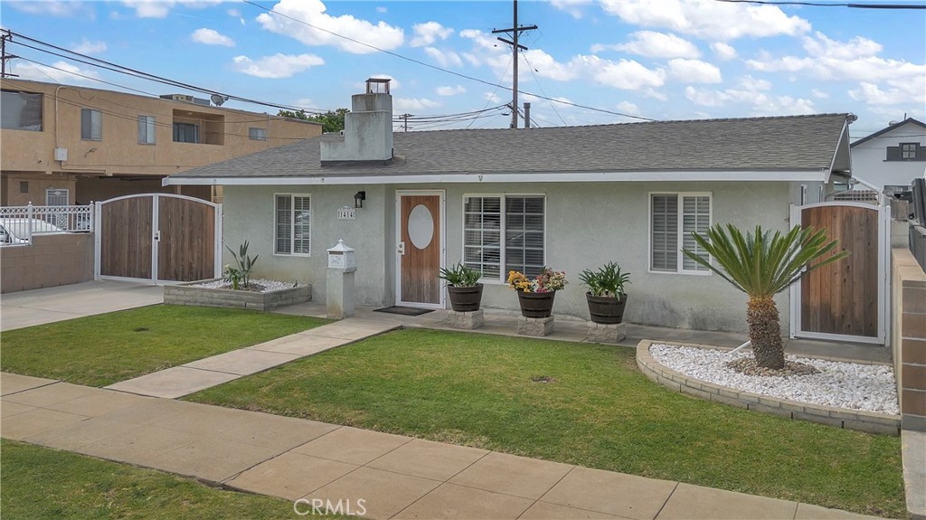 1414 West Shorb Street Alhambra, CA 91803 - Photo 2 of 33 a front view of a house with a garden and plants