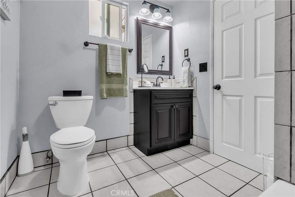 1414 West Shorb Street Alhambra, CA 91803 - Photo 23 of 33 a bathroom with a toilet sink and mirror
