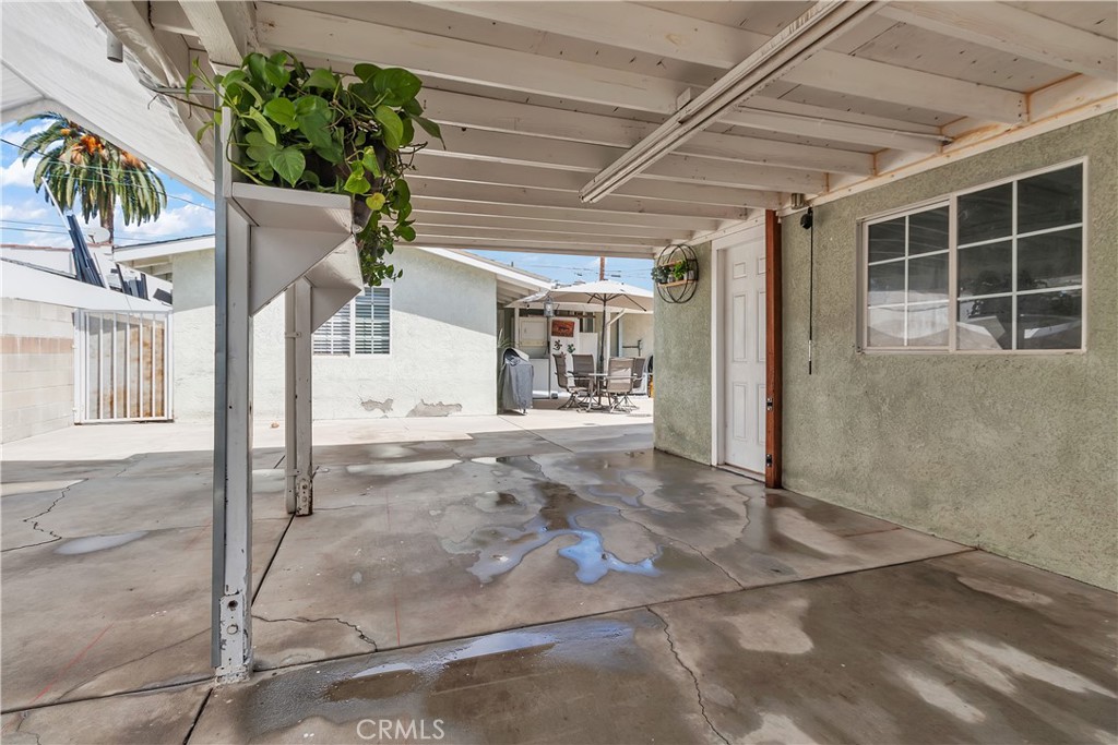1414 West Shorb Street Alhambra, CA 91803 - Photo 27 of 33 a view of a porch with a table and chairs and potted plants