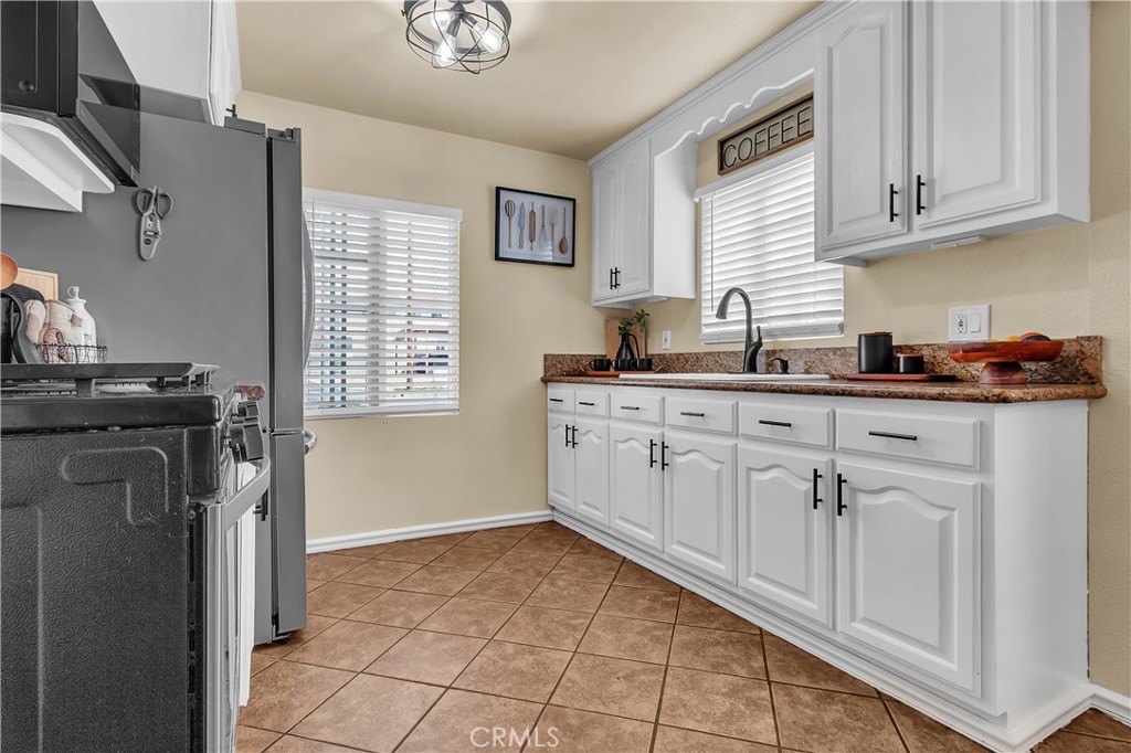 1414 West Shorb Street Alhambra, CA 91803 - Photo 8 of 33 a kitchen with cabinets and appliances
