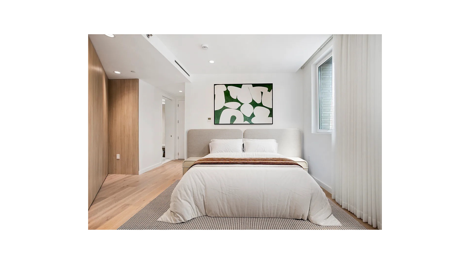 128 Woodpoint Road, Unit 2A Brooklyn, NY 11211 - Photo 6 of 15 a bedroom with a bed and a painting on the wall