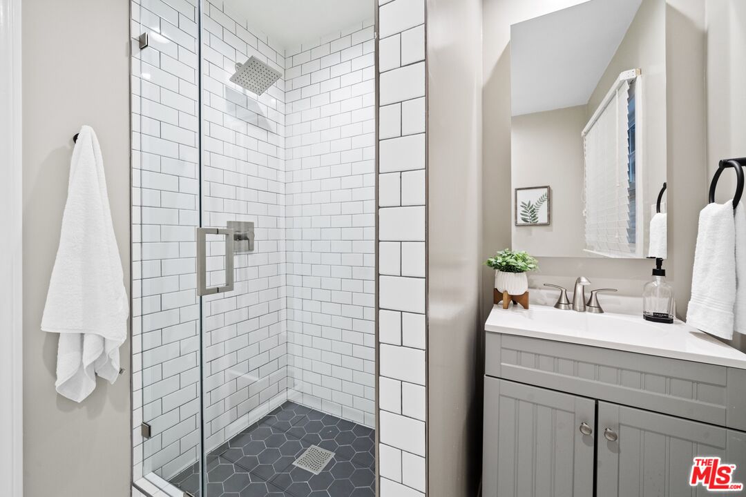3366 Troy Drive Los Angeles, CA 90068 - Photo 18 of 24 a bathroom with a sink shower and a mirror