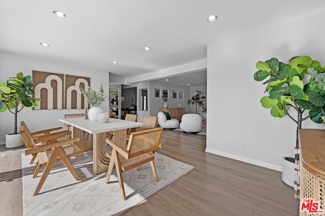 3366 Troy Drive Los Angeles, CA 90068 - Photo 3 of 24 a view of a dining room with furniture and wooden floor