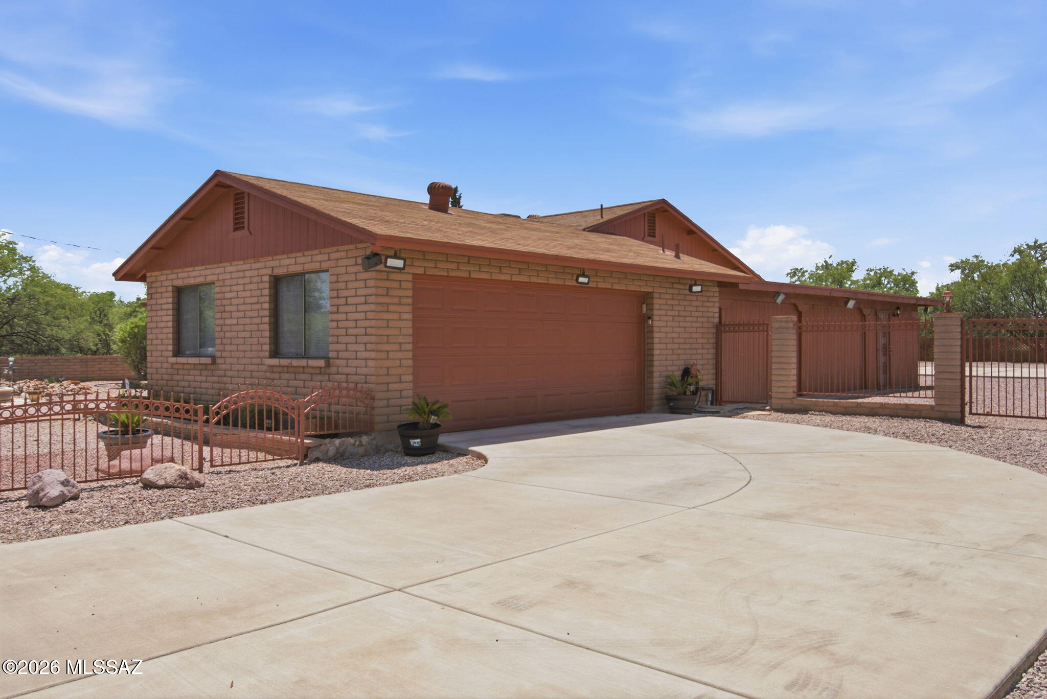766 Pachuca Court Rio Rico, AZ 85648 - Photo 1 of 27 Side view + extended garage