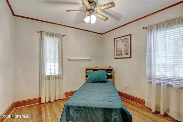 a bedroom with bed and window