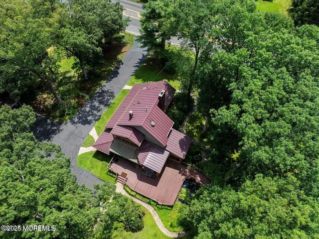 an aerial view of a house with outdoor space