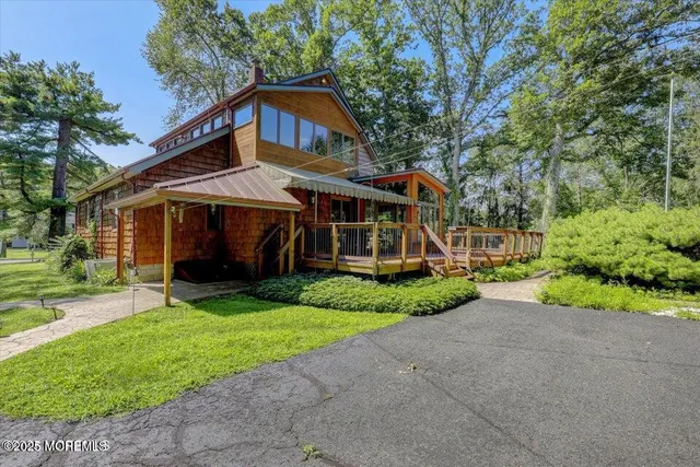 a front view of a house with a yard and porch