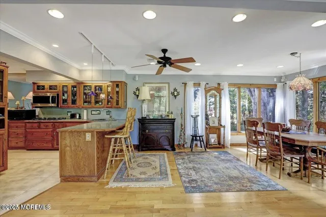 a living room with lots of furniture and kitchen view