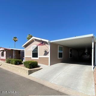 11101 East University Drive, Unit 125 Apache Junction, AZ 85120 - Photo 11 of 32 a view of a house with a patio