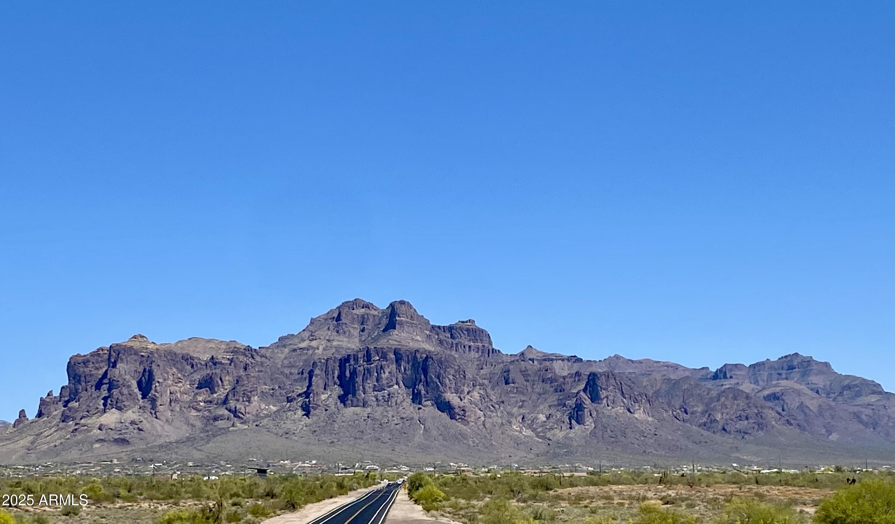 11101 East University Drive, Unit 125 Apache Junction, AZ 85120 - Photo 19 of 32 a view of a backyard with mountain