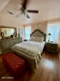 a bedroom with bed and window