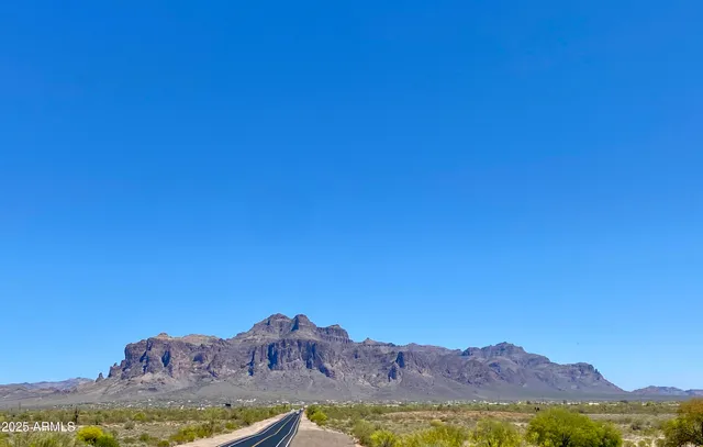 a view of a large body of water with a mountain in the background