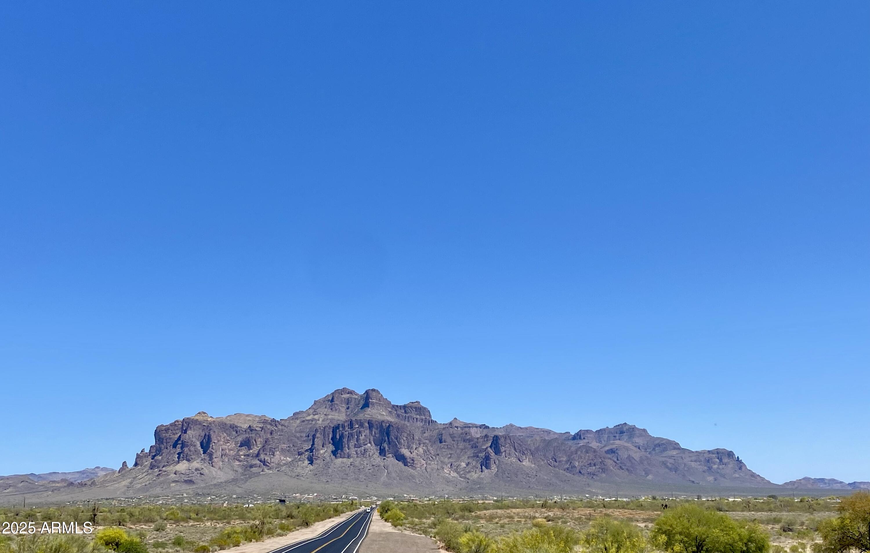 11101 East University Drive, Unit 125 Apache Junction, AZ 85120 - Photo 21 of 32 a view of a large body of water with a mountain in the background