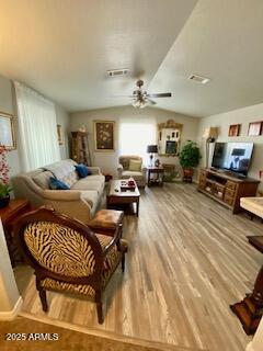 11101 East University Drive, Unit 125 Apache Junction, AZ 85120 - Photo 3 of 32 a living room with furniture a rug and a chandelier