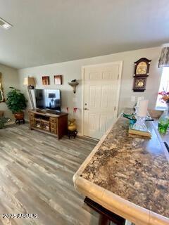11101 East University Drive, Unit 125 Apache Junction, AZ 85120 - Photo 8 of 32 a living room with furniture and a flat screen tv