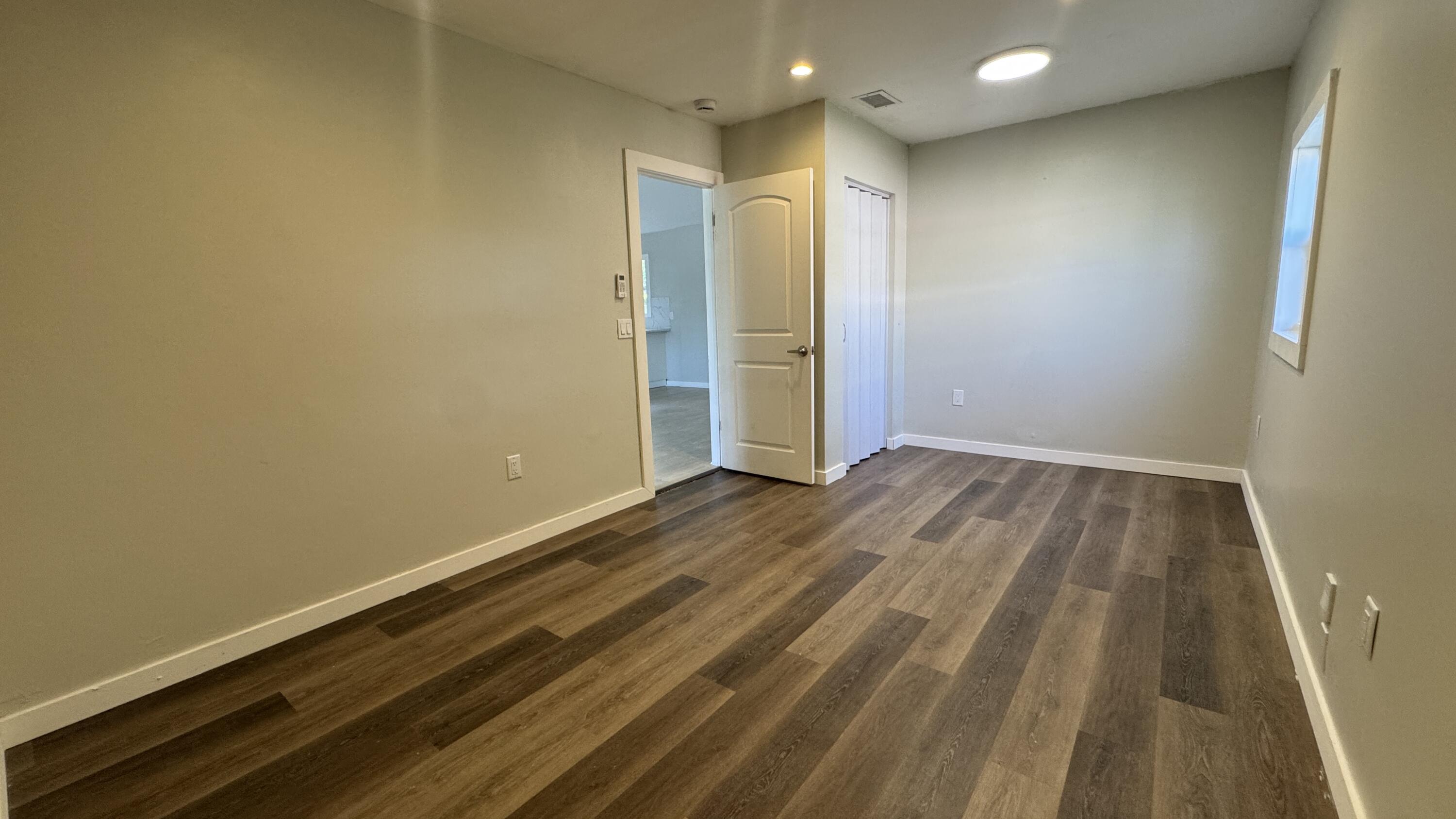 8395 Garden Gate Place Boca Raton, FL 33433 - Photo 14 of 35 a view of room with wooden floor and entryway