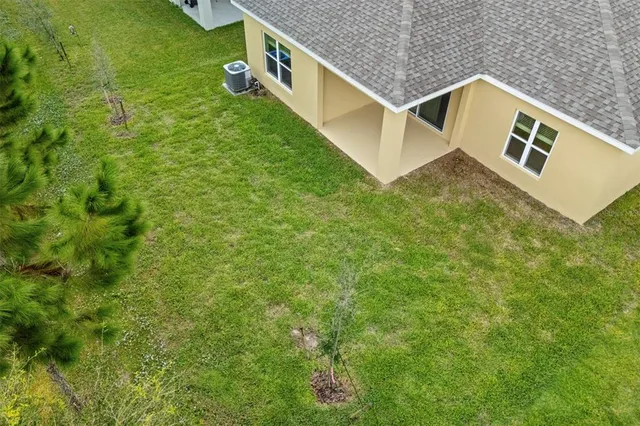 a sign that is sitting in front of flowers