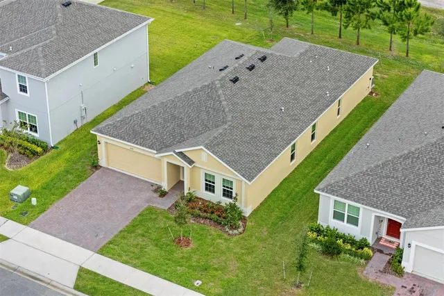 a aerial view of a house with a yard