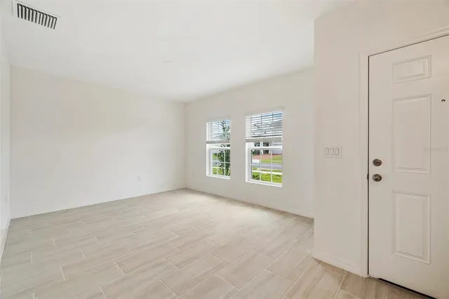 an empty room with windows