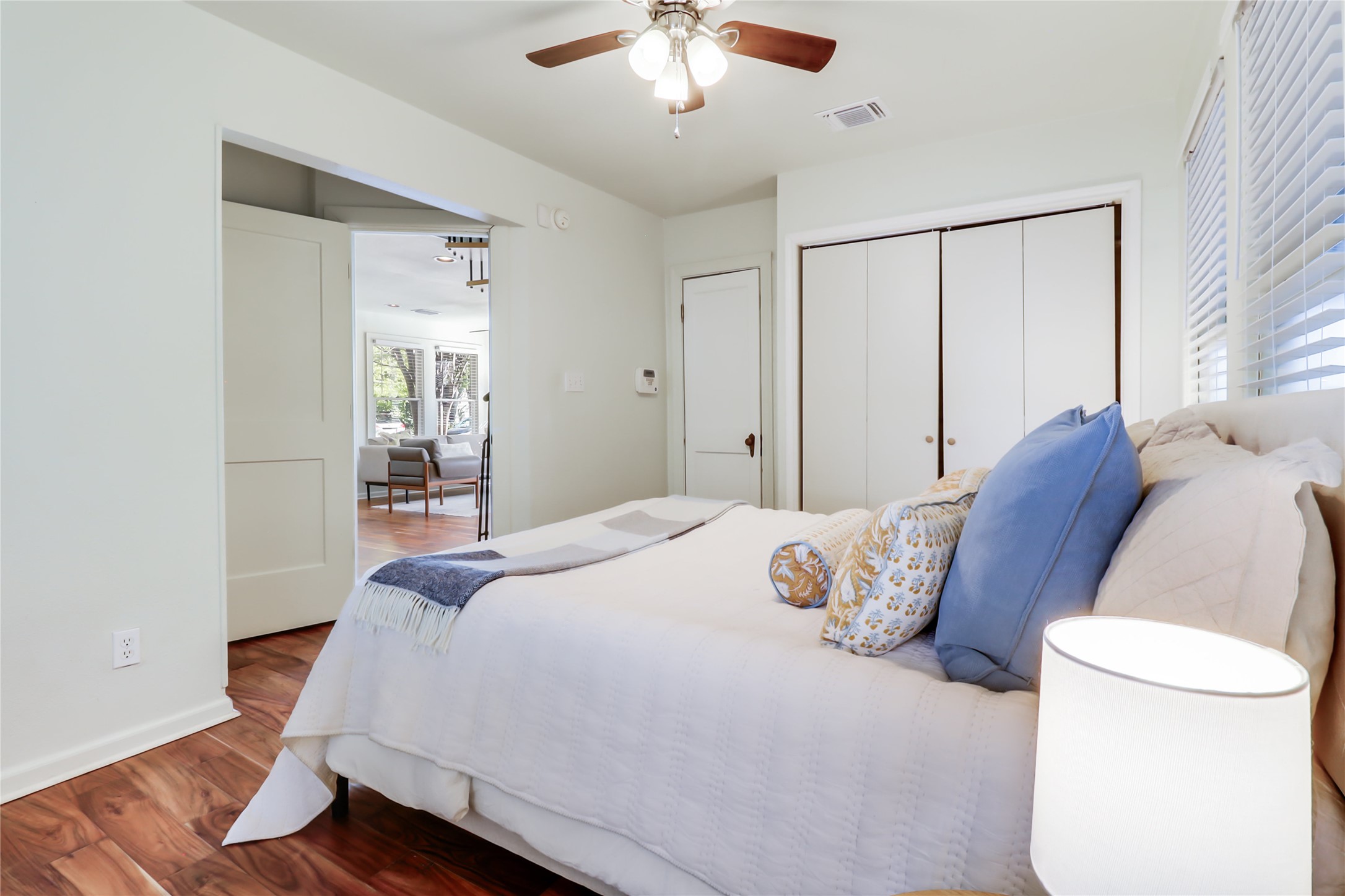 1105 West 43rd Street Austin, TX 78756 - Photo 11 of 22 a bedroom with a bed and a chandelier