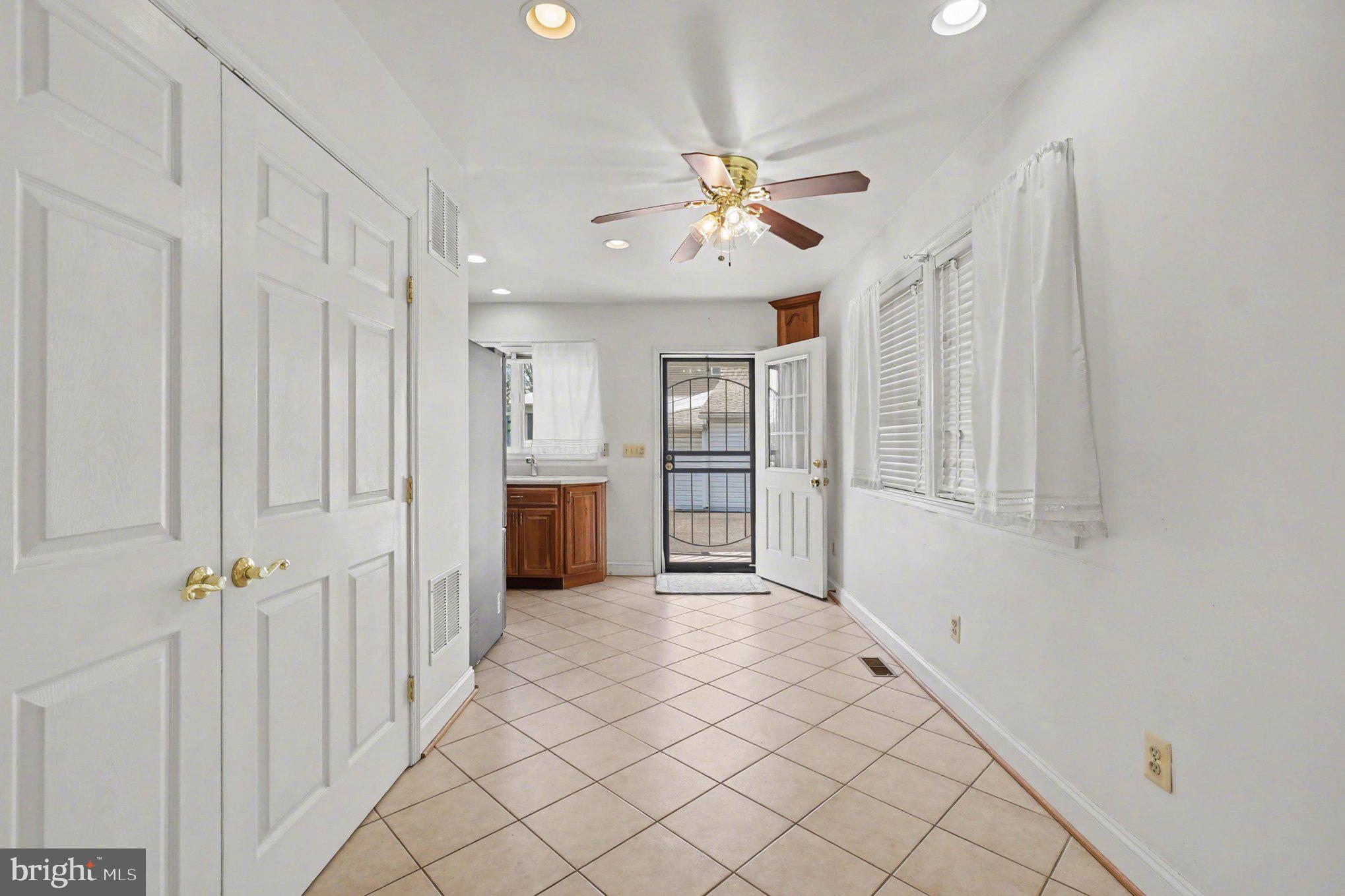7908 Oakleigh Road Baltimore, MD 21234 - Photo 12 of 41 a view of a hallway with a chandelier