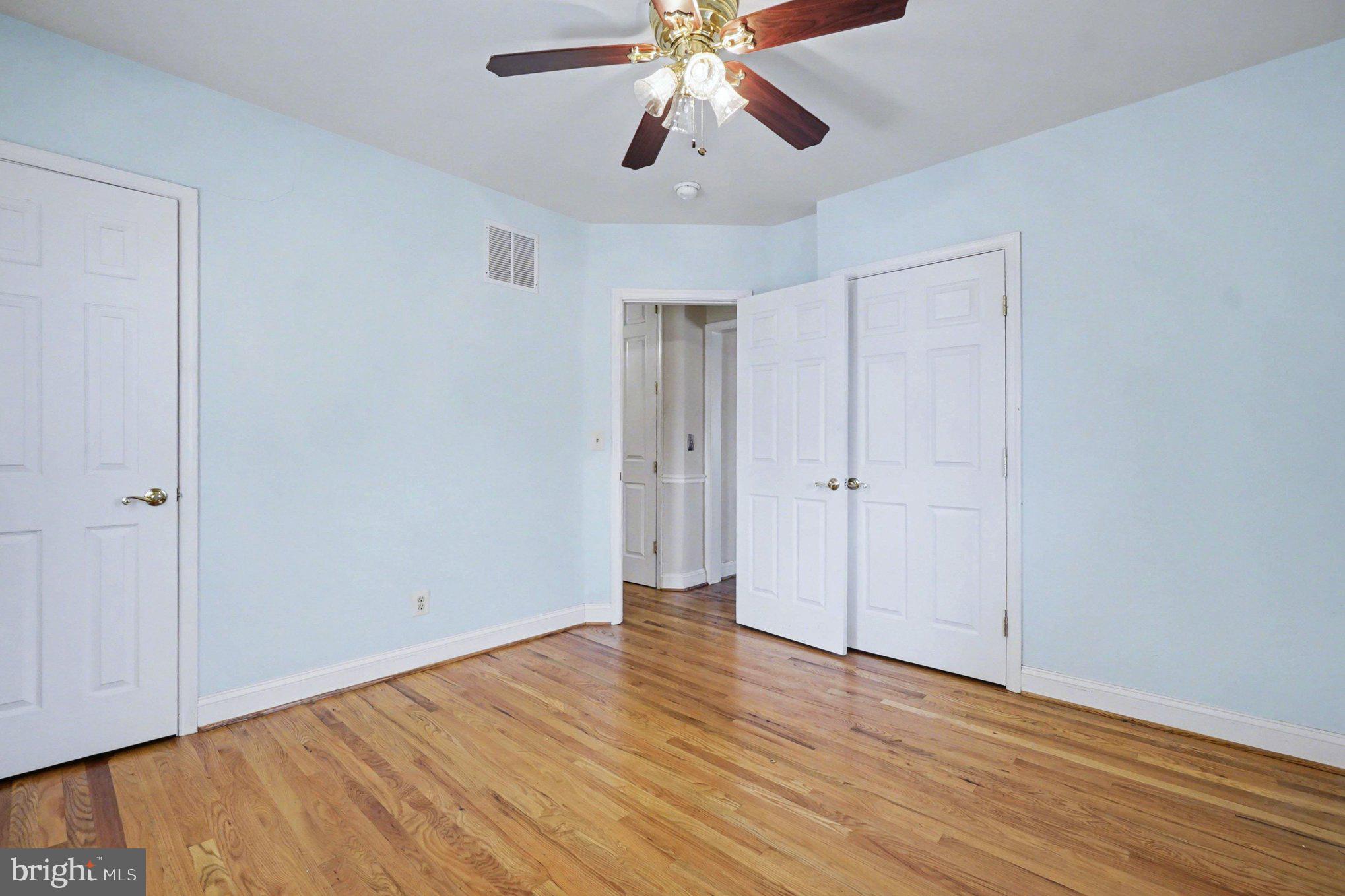 7908 Oakleigh Road Baltimore, MD 21234 - Photo 13 of 41 a view of an empty room with wooden floor
