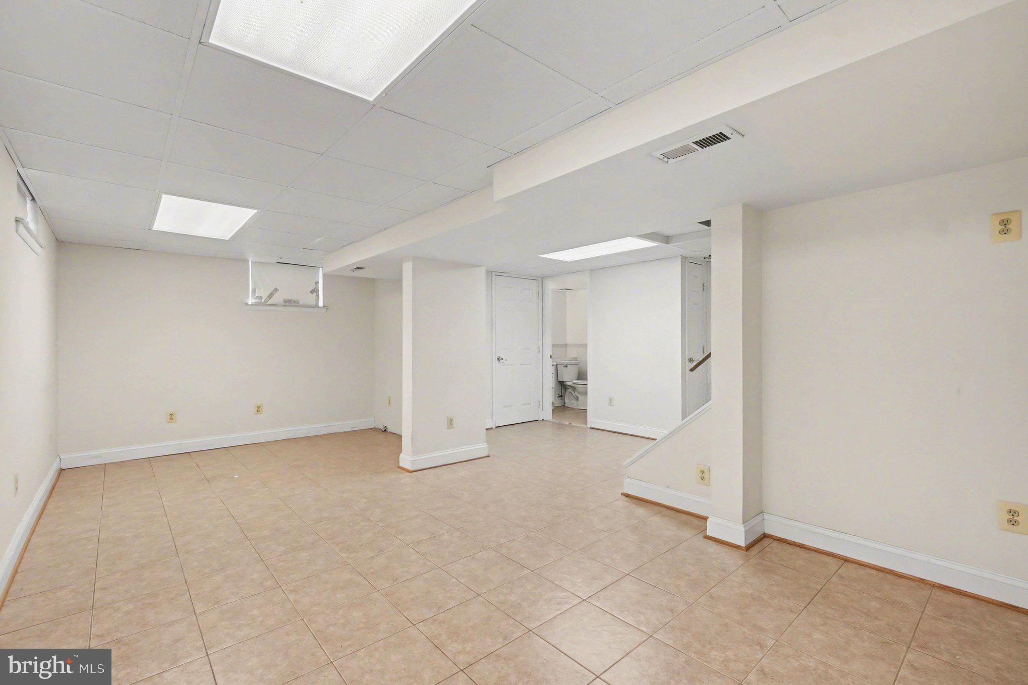 7908 Oakleigh Road Baltimore, MD 21234 - Photo 26 of 41 an empty room with a natural light