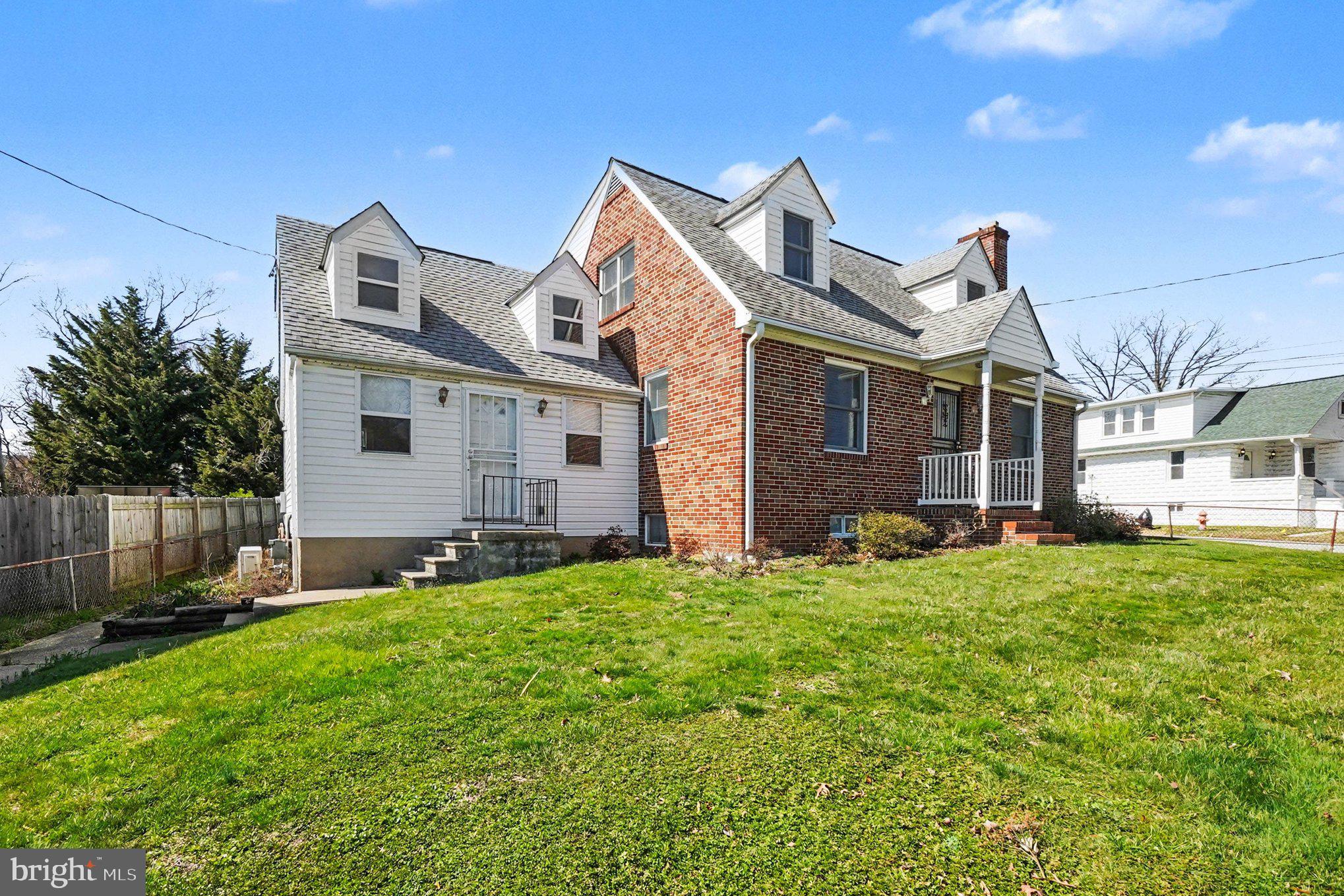 7908 Oakleigh Road Baltimore, MD 21234 - Photo 3 of 41 a front view of a house with a yard
