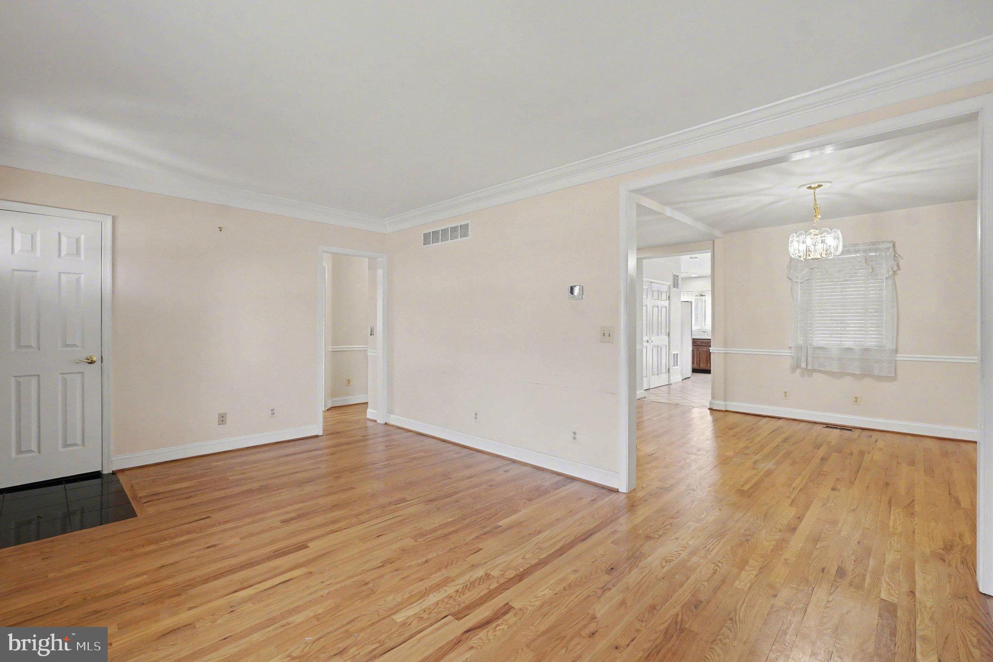 7908 Oakleigh Road Baltimore, MD 21234 - Photo 6 of 41 a view of an empty room and wooden floor