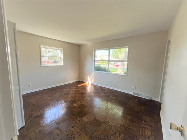 539 Ridgewood Road Elk Grove Village, IL 60007 - Photo 13 of 15 a view of an empty room with wooden floor and a window