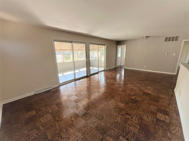 539 Ridgewood Road Elk Grove Village, IL 60007 - Photo 5 of 15 wooden floor in an empty room with a window