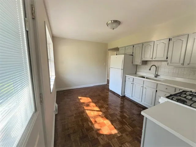 a kitchen with a sink and cabinets