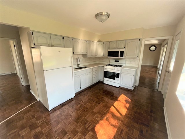 539 Ridgewood Road Elk Grove Village, IL 60007 - Photo 9 of 15 a kitchen with white cabinets and white appliances