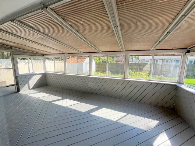 539 Ridgewood Road Elk Grove Village, IL 60007 - Photo 10 of 15 a view of an empty room with wooden floor and a window
