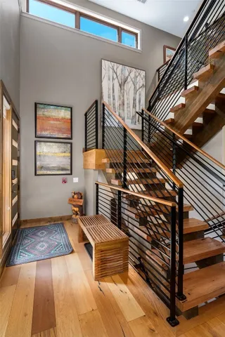 a bedroom with a bed and a couch next to a window